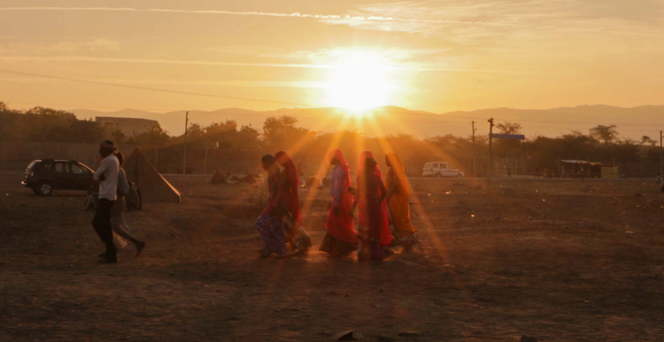 Local women walking through Pushkar at sunset